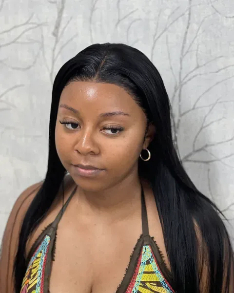 A straight Peruvian lace-front wig worn past the shoulder